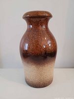 Front view of brown to beige glazed ceramic vase