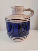 Front view of Carstens jug vase showing blue band and handle