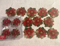 Group view of napkin rings in package and multiple coaster stacks