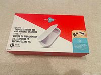 Front of sealed retail box showing product image, branding and model