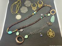 Full group view showing necklaces, earrings, pendants and charms