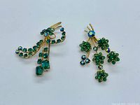 Both brooches side by side showing overall design and size