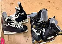 Both pairs of skates side by side in box