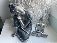 Both Buddha statues together showing relative sizes