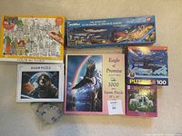 Overall view of all seven puzzle boxes and bag