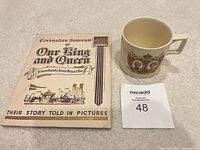 Mug and booklet front view with lot card