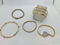 All seven bracelets laid out