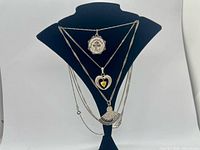 All three sterling silver necklaces displayed on bust