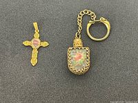 Front view of cross pendant and keychain showing petit point designs and gold-tone metal