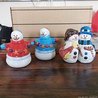 All four snowman shakers front view