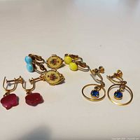 All four pairs of earrings laid out