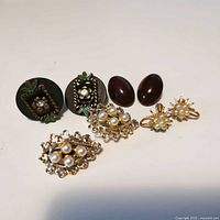 All four pairs of earrings laid out for overview