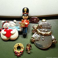 All six Christmas pins displayed
