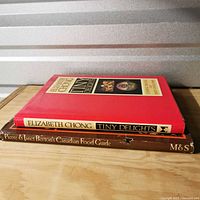 Both cookbooks stacked, showing spines and covers