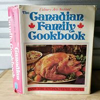 Front cover with dust jacket showing title and turkey image
