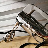 Side view of mixer showing Mixette branding and beaters attached