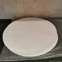 Top view of stacked round white filter papers