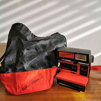 Front view of camera with carrying bag