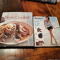 Cookbook and catalogue side by side showing full covers