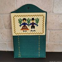 Front view showing cross stitch panel and alphabetical index