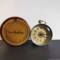 Front view of clock with box lid