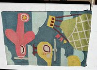 Full view of children's wool rug showing airplane, hot-air balloon and clouds