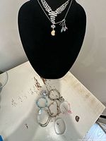 Entire jewellery assortment on bust and table