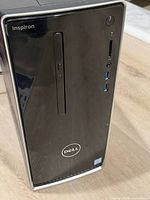 Front view of Dell Inspiron 3668 tower showing optical drive, ports and branding