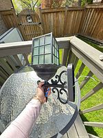 Side view showing full lantern, arm, mounting plate