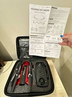 Drone, controller and manual in carry case