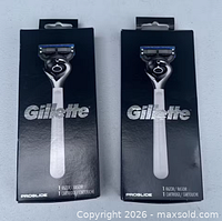 Front view of two sealed Gillette ProGlide razor boxes
