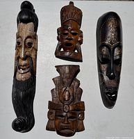 Front view of all four wood masks