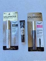 Front view of all three carded cosmetics