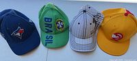 Front view of all four caps side by side