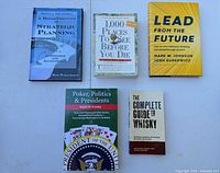 Front covers of all five books arranged on flat surface