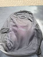 Front view showing Oakley logo, front compartment and mesh side pockets