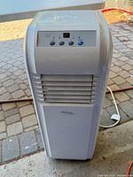 Front view showing overall unit, control panel, vent and power cord