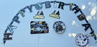 Full lot showing banner, balloon package, plates and toppers