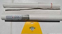 Three wallpaper rolls with smoother visible