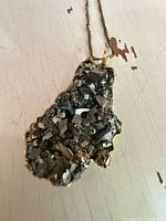 Front view of pyrite nugget pendant on chain