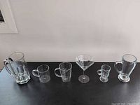 Full group of six glass drinkware pieces