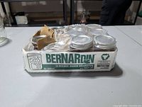 Front of Bernardin 12-pack box with jars visible, damaged cellophane