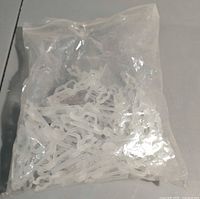 Full bag of translucent plastic clips