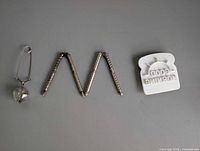 Overall view of nutcracker, tea infuser and extraneous item