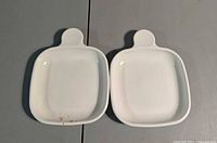 Top view of both white ceramic handled dishes