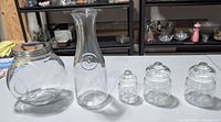 All five clear glass containers displayed together