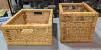 Two square wicker rattan baskets side by side showing exterior weave and handles