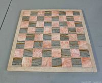 Top-down view of entire chess/checkers board showing marble and onyx squares