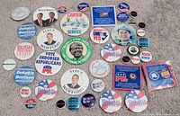 Full spread of assorted campaign buttons and cards