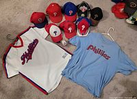 Overall view of caps, jersey, T-shirt and signed baseball